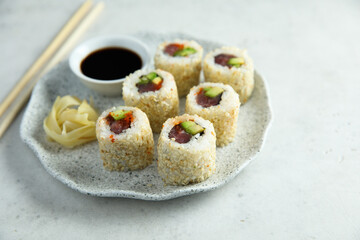 Obraz na płótnie Canvas Sushi rolls with tuna and avocado