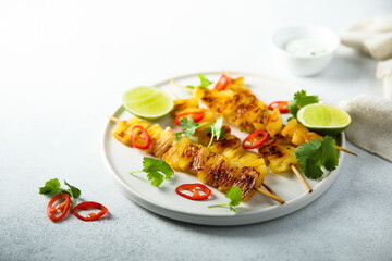 Healthy pineapple skewers with chili and lime