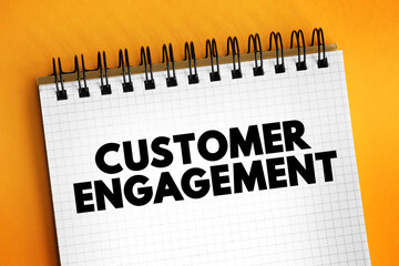 Customer engagement - the emotional connection between a customer and a brand, text on notepad