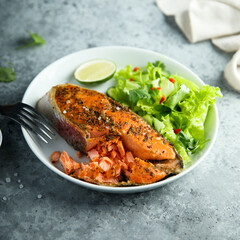 Roasted salmon steak with green salad