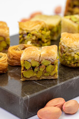 Varieties of pistachio baklava. Variety of baklava isolated on white background. Traditional...