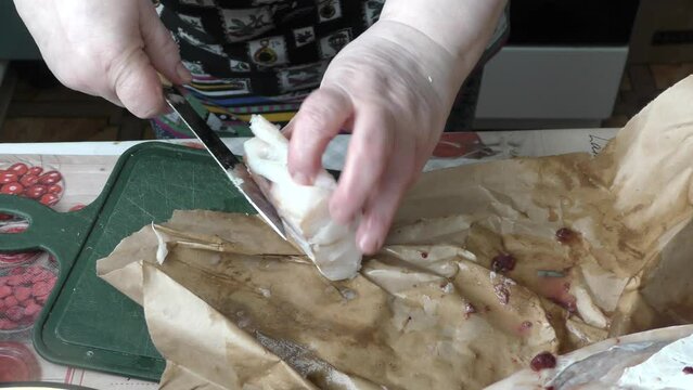 the cook cuts into pieces sea fish cod