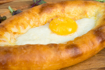 ajara Khachapuri with cheese, egg and butter, georgian kitchen