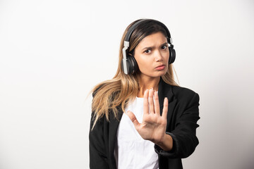 Fototapeta premium Businesswoman listening music in headphones