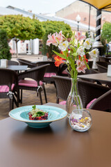 Blue plate vinaigrette decorated with microgreens