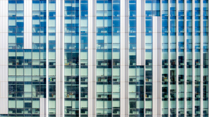 Fototapeta premium Facade of a glass building. There are many offices.