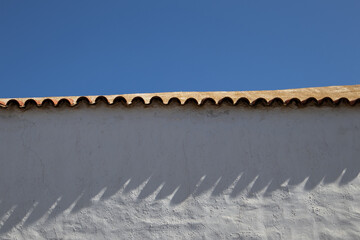 White spanish architecture and blue sky