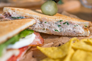 Chicken and bacon sandwich, with tomatoes, pickles, olives