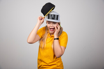 Beautiful young girl wearing a fashion cap