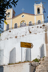 A church of the old town of Kyparissia, Greece, translation in the greek script: "Holy Church of the Holy Trinity, Holy Church of the Transfiguration of the Savior Raisin fountain"