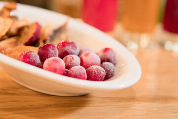 forest berry compotes with freshly frozen berries on the background