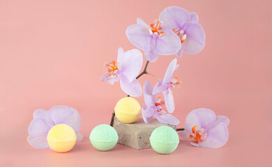 Handmade bath bombs and orchid flowers. The concept of spa beauty. Close-up of bath balls. The concept of therapy. I'm taking a relaxing bath. Homemade spa product. Selective focus
