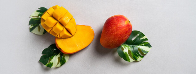 Mango background design concept. Top view Diced fresh mango fruit on gray table.