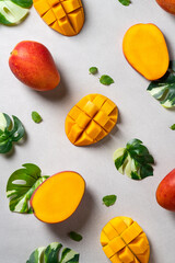 Mango background design concept. Top view Diced fresh mango fruit on gray table.