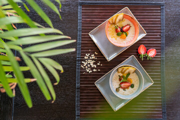 Healthy breakfast in a bowl with homemade baked granola, fresh strawberries