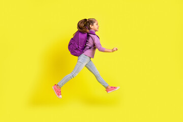 Fototapeta na wymiar Full size profile side photo of elementary school girl jump rush discount wear backpack isolated bright color background