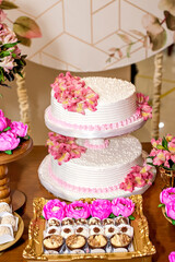 wedding cake decorated on sweet table.