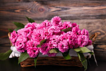 Bouquet of pink carnations in basket