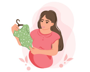 A pregnant mother holds baby clothes in her hands, a happy expectant mother is expecting a baby. Preparing for childbirth, a girl with a big belly in late pregnancy, the concept of motherhood