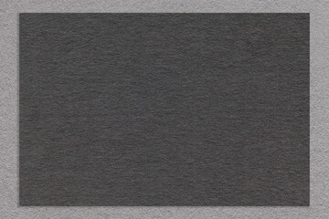 Fototapeta premium Texture of craft black color paper background with gray border, macro. Structure of vintage dense kraft grey cardboard