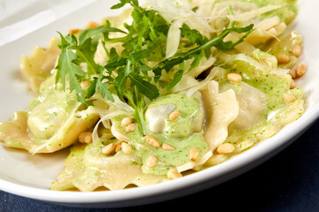 italian ravioli with pesto sauce
