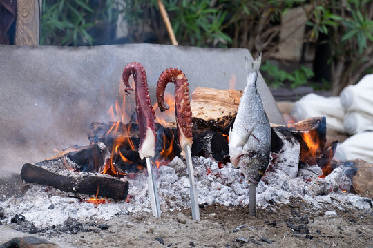 Typical food of the Andalusian coast, octopus and fish roasting.