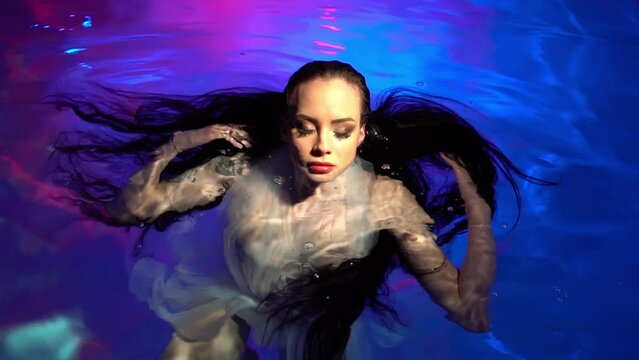 Slow Motion Half Underwater View Of Caucasian Mode