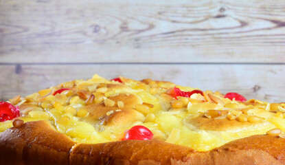 Typical cake Catalonia, Spain, with cream, pine nuts, almonds and candied cherry, sweet.