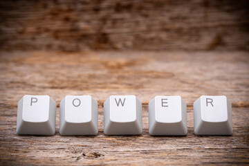 Computer keyboard keys arranged to spell POWER word