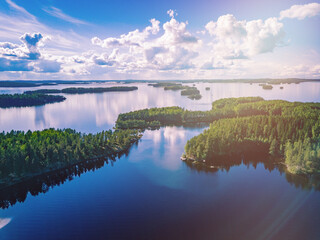 Aerial view of blue lakes and green woods in summer Finland.