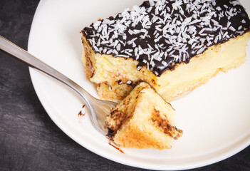Fresh baked cheesecake on white plate. Delicious dessert