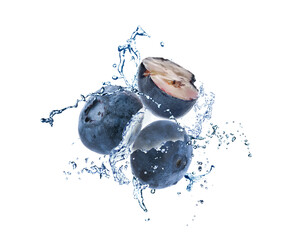 Fresh ripe blueberries and splashing water on white background