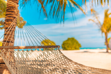Tropical hammock in paradise at sunset, closeup recreational summer background. Relaxation,...