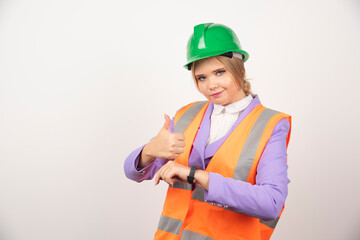 Female industrial employee standing on white background