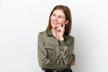 Young English woman isolated on white background thinking an idea while looking up