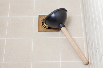 Rubber plunger on shower floor