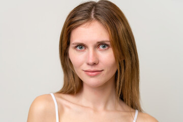 Portrait of pretty young woman over isolated white background