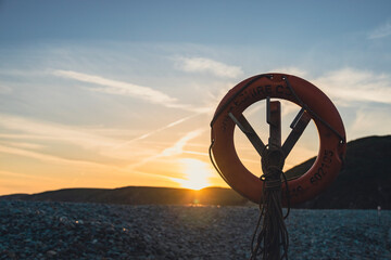 lifebouy at newgale beach pembrokeshire sunset