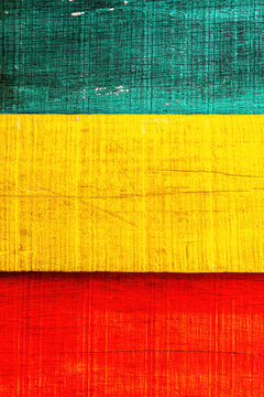 Wooden Reggae grunge wall in Rasta color in red yellow and green with textured. For Graphics Poster Background copy space. Rasta Reggae music Jamaica Style Concept