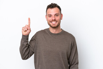 Fototapeta premium Young Brazilian man isolated on white background pointing up a great idea
