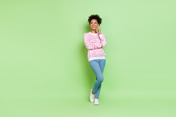 Photo of dreamy lady look empty space imagine romantic date wear striped shirt isolated green color...