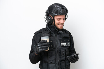 Brazilian soldier man isolated on white background holding coffee to take away and a mobile