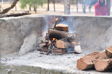 bonfire with logs to make an argentine asado (barbecue)