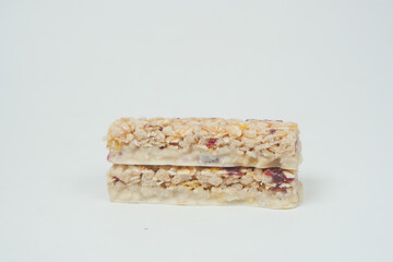 Almond , Raisin and oat protein bars on table 