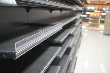 Empty supermarket shelves, selective focus 