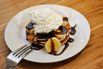 Banana Pancakes with Chocolate Sauce and Whipped Cream
