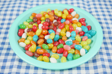 slow motion of Jelly beans dropping on a plate ,