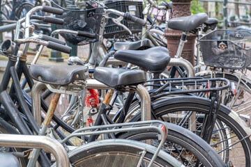 Bicycles parked background. Bikes parking at Amsterdam city center, close up. Netherlands Holland