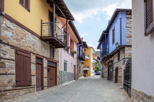 Greece, destination Arnaia village Chalkidiki. Mansion with loggia, tile roof, covered balcony.
