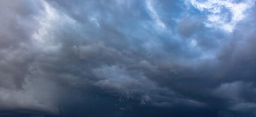 Naklejka na ściany i meble Cloud on blue sky background. White and grey color cloudscape, gloomy weather